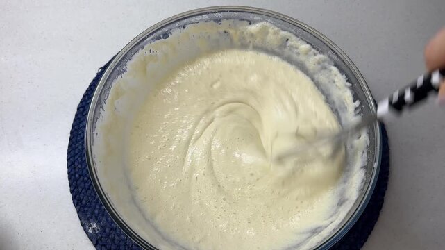 Mixing dough batter with whisk