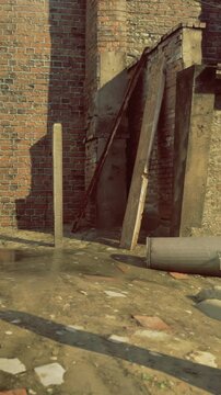 A construction site shows a brick wall with a vertical post. Water gathers on the ground. Wooden planks lean against the wall. The sun provides bright lighting to the area.