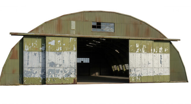 An old, weathered quonset hut with olive green corrugated metal siding and large, chipped white sliding hangar doors against black