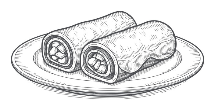 Two rolled crepes filled with fruit a plate filling