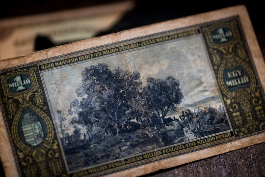 Reverse side of a vintage Hungarian Egymillio Pengo banknote, showing landscape illustration, ornate border details, aged paper texture, and historic European inflation currency design.