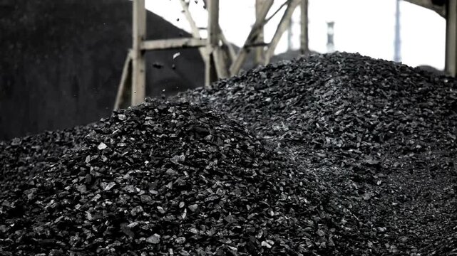 huge pile of coal mine background being loaded