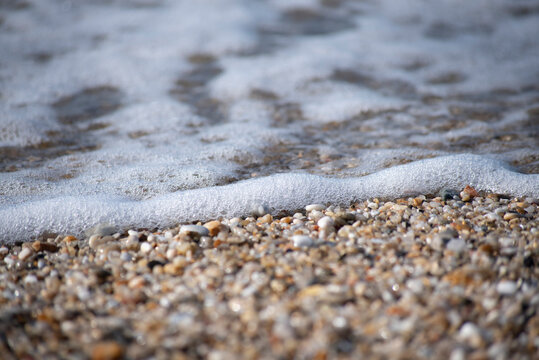 close up of a sand and sea water