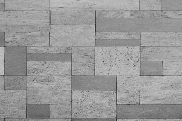 Front view of a wall made of gray slabs. background of a new and modern wall or building exterior grey slabs Marble brick pattern floor abstract natural marble black gray wall Top view and front view © Maxim Chuev