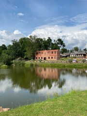 Fototapeta premium Landscape. Castle palace in lake water reflection. Castle reflection in lake water. Panorama.