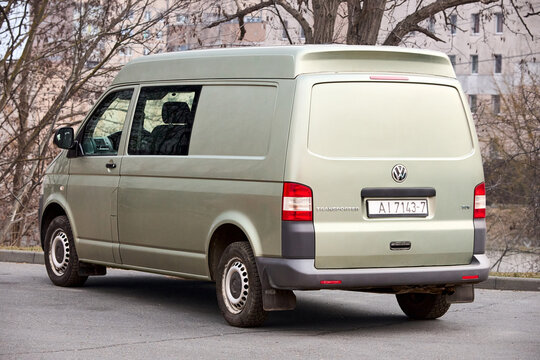 Minsk, Belarus - March, 17 2026: gray Volkswagen Transporter T5 short wheelbase SWB with medium roof van parked in street rear back view.