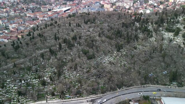Eyup Cemetery hill in Istanbul, fly above shot