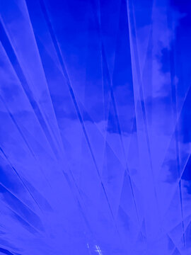 abstract blue and purple laser beams and lights during live music concert background