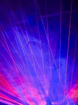 neon laser beams and lights during live music concert on stage