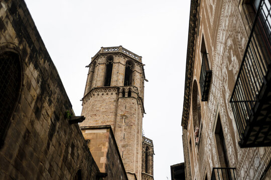 Historic bell tower rising above medieval streets in Barcelona Spain showcasing Gothic architecture and authentic atmosphere of the old city district