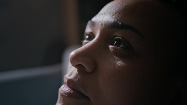 Closeup portrait of Biracial woman staring at one point before slowly closing her eyes, expressing frustration, emotional tension and mental fatigue