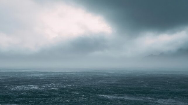 Landscape photograph of a vast ocean. the sky is filled with dark, ominous clouds that are covering most of the sky. the clouds are thick and billowing, creating a dramatic and ominous atmosphere.