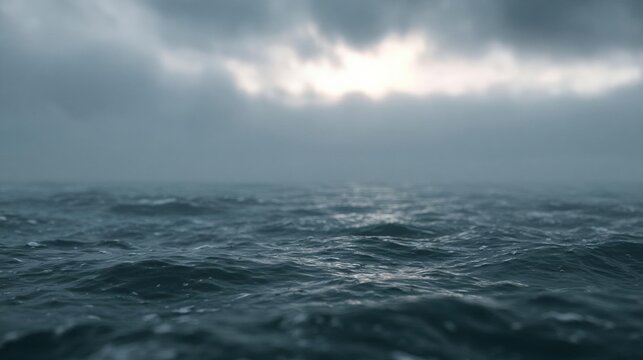 Close-up of the ocean. the sky is filled with dark, ominous clouds that are covering the entire horizon. the clouds are white and fluffy, and they appear to be floating above the water.