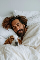 Obraz premium Man sleeping with dog nestled in white bedroom bed linens