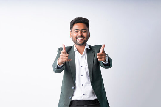 young indian businessman standing on white background