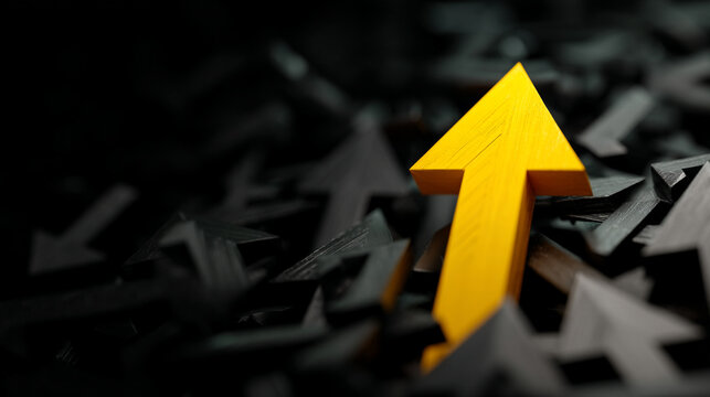 Single yellow arrow ascending from a crowd of dark arrows with stand out