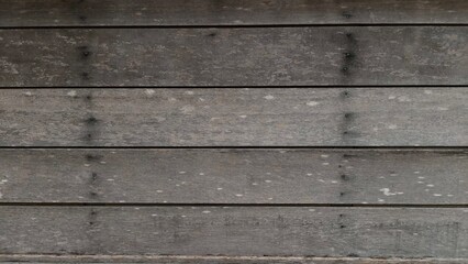 Obraz premium Dark rustic wooden plank texture with horizontal alignment and natural weathered details, ideal for product display mockups, website banners, social media templates, and branding presentations. Suitab