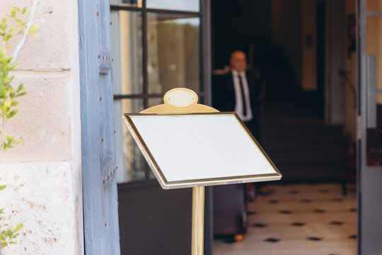 Empty menu stand offering copy space for daily specials or messages in front of a hotel or restaurant entry