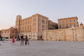 Cagliari city square at golden hour with dynamic people movement, Bastion of Saint Remy, Sardinia, Italy © anatoliycherkas