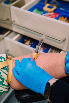 Vacutainer Blood Collection with Butterfly Needle Inserted in Patient's Arm. Healthcare, clinical diagnostics, and medical concepts.