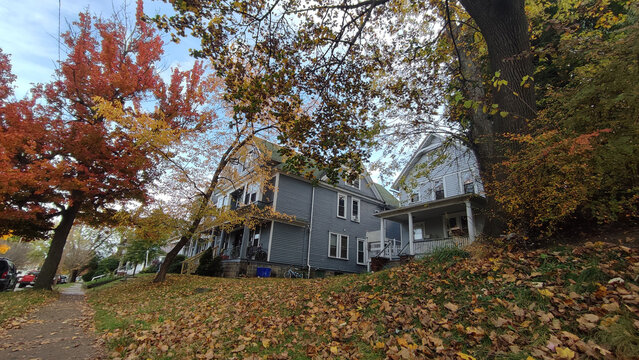 Autumn Charm in Scranton: A Blue Historic Residence Tucked into a Hillside with Vibrant Foliage
