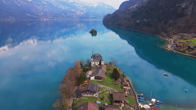 Droneshot of Iseltwald and the beautiful lake Brienzersee in the canton of Bern Switzerland during Spring.