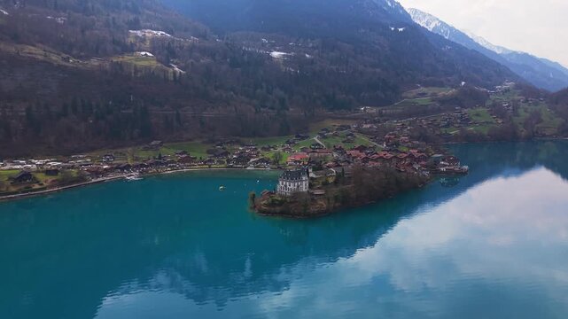 Iseltwald during Spring shot by a drone over the lake Brienzersee in the canton Bern, Switzerland.