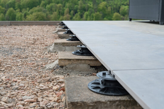 Close-up of an adjustable pedestal used for leveling a terrace deck.