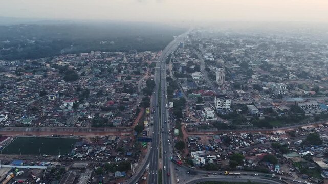 Hyperlapse aerial view of N1 highway cutting through the urban landscape of accra, ghana