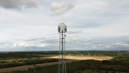 Fototapeta premium Signal transmission tower in rural agricultural field