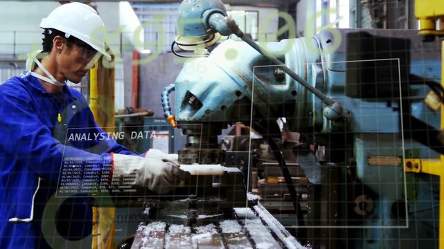 Male machinist loading metal part into mill chuck, HUD analysing binary data aligning axis for cut
