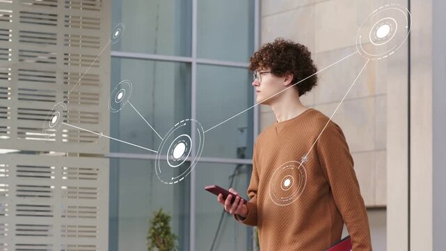 Man holding smartphone and red folder, tapping screen and activating AR network for tech demo