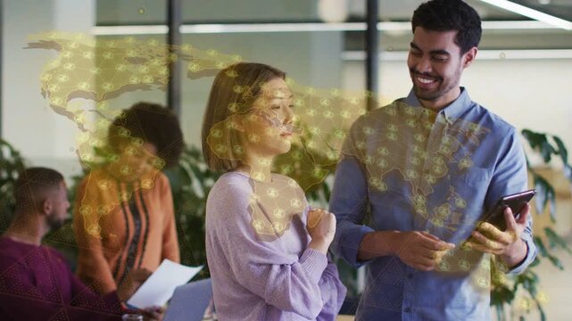 Man tapping phone, activating animated world-map overlay on torsos, woman leaning in for business