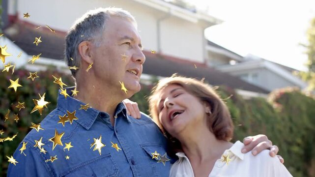 Couple hugging outside home, man singing and causing gold star overlay drifting for realty ad
