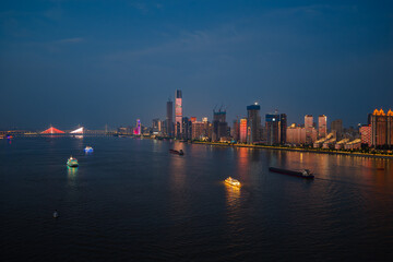 Naklejka premium Night view of Wuhan, Hubei, China's city skyline and landmarks