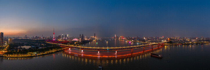 Naklejka premium Night view of Wuhan, Hubei, China's city skyline and landmarks