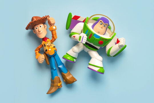 Woody and Buzz Lightyear action figures characters from the Toy Story movie Disney Pixar saga. Illustrative editorial