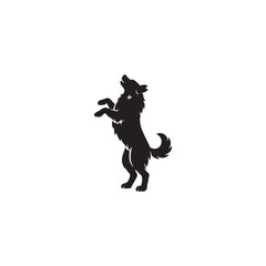 Fototapeta premium Black silhouette of a wolf standing on hind legs howling d