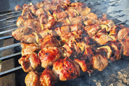 Grilled meat skewers on brazier