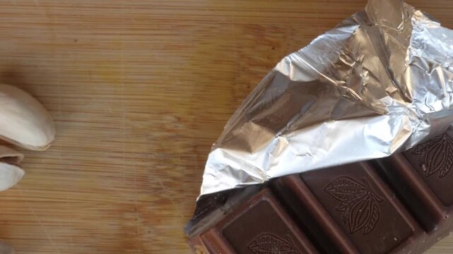 Chocolate bar partially wrapped, evoking indulgence and luxury