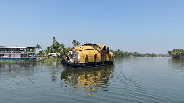traditional houseboats running in sea backwater with amazing sky at morning video taken at Alappuzha
