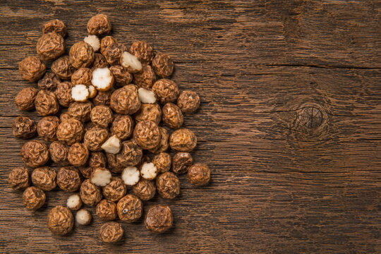 Tiger Nuts Chufa on Rustic Wooden Surface with Natural Space