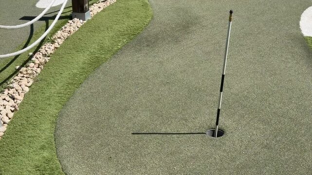 close-up shot at ground golf course hole