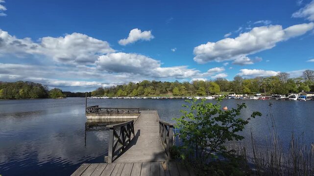 Static View of Lake and Wooden Landing Platform in Hagaparken Stockholm on Sunny Spring Day