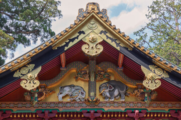 Fototapeta premium Golden Ornamented Temple Roof with Sculpted Animals