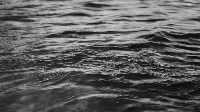 Black and white texture of ripples in the sea