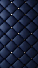 Fototapeta premium Closeup view of deep navy blue tufted upholstery with golden decorative studs creating a diamond pattern