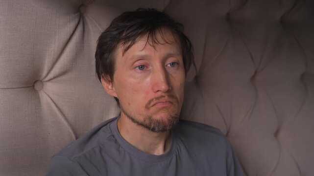 Sad man sniffing loudly through nose, high quality uncompressed audio recording. Emotional breathing and nasal sound captured in real time. Sadness, vulnerability and human emotion concept.
