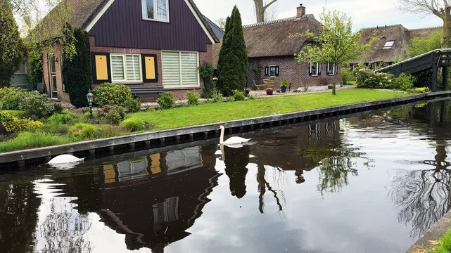rural dutch traditional country small old town Giethoorn with canals and boats, Netherlands