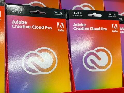 Adobe Creative Cloud Pro prepaid subscription boxes for 12 months membership on display at an electronics retail store in Chiyoda district - Tokyo, Japan, December 22, 2025